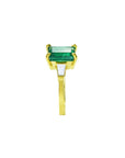 the side profile of this colombian emerald ring shows the side top and band profile on a white background.