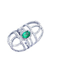 Sterling silver ring with a natural oval emerald center and CZ halo accent, featuring a wide, openwork band.