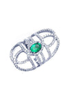 Sterling silver ring with a natural oval emerald center and CZ halo accent, featuring a wide, openwork band.