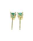 A pair of emerald stud earrings in 14k yellow gold, underside profile view.