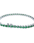 Colombian emerald tennis bracelet with round green emeralds in 14K white gold.