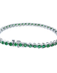 Colombian emerald tennis bracelet with round green emeralds in 14K white gold.