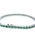 Colombian emerald tennis bracelet with round green emeralds in 14K white gold.