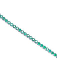 Colombian emerald tennis bracelet with round cut, deep green emeralds in 14K white gold.