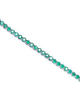 Colombian emerald tennis bracelet with round cut, deep green emeralds in 14K white gold.