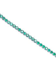 Colombian emerald tennis bracelet with round cut, deep green emeralds in 14K white gold.
