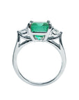 The lateral profile of this emerald ring displays the top, gallery and band on a white background.