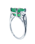 The underside view of this emerald ring displays the top and gallery and band on a white background.