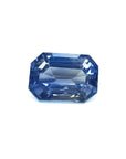 Natural loose sapphire emerald-cut, a vibrant medium blue hue gemstone with exceptional light reflection.