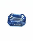 Natural loose sapphire emerald-cut, a vibrant medium blue hue gemstone with exceptional light reflection.