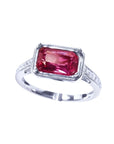 GIA certified 1.38 ct. fancy cut purplish pink sapphire ring with diamond accents on a white gold band.