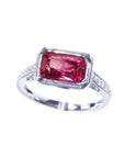 GIA certified 1.38 ct. fancy cut purplish pink sapphire ring with diamond accents on a white gold band.