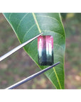 Emerald cut 6.11 ct natural loose watermelon tourmaline with bluish-green and red-orange colors.