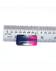 Emerald cut 6.11 ct natural loose watermelon tourmaline with bluish green and red-orange hues, measured against a ruler.
