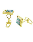 Gold cufflinks with natural emeralds displaying its side profile on a white background.