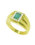 Men's 14K yellow gold ring with a rectangular emerald-cut Muzo emerald surrounded by white stones.