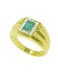Men's 14K yellow gold ring with a rectangular emerald-cut Muzo emerald surrounded by white stones.