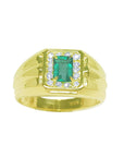 Gold ring for men with a natural emerald and diamonds accent on topside profile display.