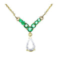 Emerald necklace with a natural diamond tear drop weighting 0,69 carats dangling from a V shaped with round cut emeralds.