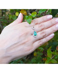 1.35 ct natural emerald pear pendant necklace with diamond bail on 14K white gold chain.