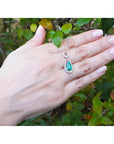 1.35 ct natural emerald pear pendant necklace with diamond bail on 14K white gold chain.