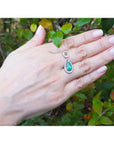 1.35 ct natural emerald pear pendant necklace with diamond bail on 14K white gold chain.