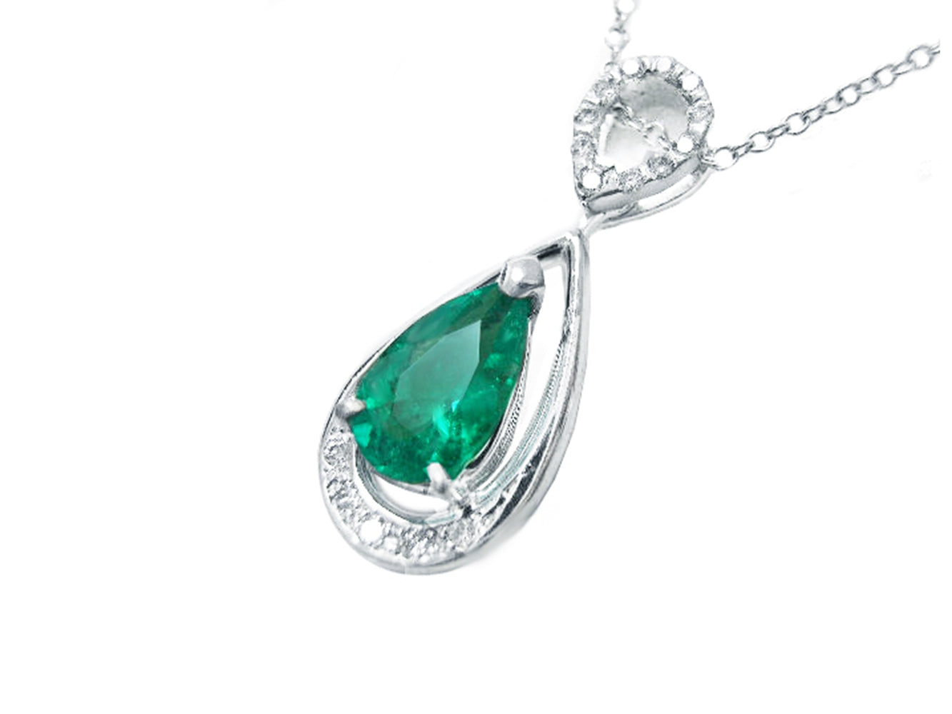 Teardrop-shaped emerald pendant with diamond accents on a white background
