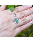 1.35 ct. natural pear-shaped emerald pendant necklace in 14K white gold with diamond bail.