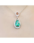 1.35 ct. natural emerald pear-shaped pendant necklace in 14K white gold with diamond bail.