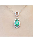 1.35 ct. natural emerald pear-shaped pendant necklace in 14K white gold with diamond bail.