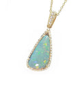 Pear-shaped 8.05 ct Australian opal pendant with bluish-green play of color, halo diamonds, and 18K yellow gold chain.