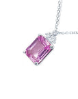 Tilted on the left side and top view a natural pink sapphire necklace emerald cut 14k white gold.