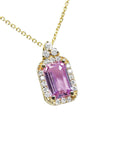 stunning natural pink sapphire necklace pendant featuring a sparkling rectangular emerald cut and set in 14k gold.