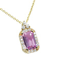 stunning natural pink sapphire necklace pendant featuring a sparkling rectangular emerald cut and set in 14k gold.