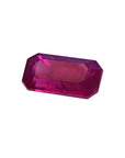 1.11 carat natural emerald-cut ruby gemstone with deep pink-red hue.