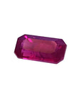 1.11 carat natural emerald-cut ruby gemstone with deep pink-red hue.