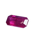 1.11 carat natural ruby gemstone, emerald cut, vibrant purplish-red, loose.