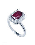 Women's 14K white gold ring with an emerald-cut deep red ruby and diamond halo.
