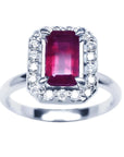 Emerald-cut ruby ring with diamond halo in 14K white gold.