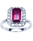 Emerald-cut ruby ring with diamond halo in 14K white gold.