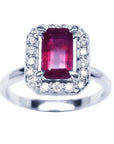 Emerald-cut ruby ring with diamond halo in 14K white gold.