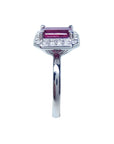 Women's 14K white gold ring with an emerald-cut deep red ruby and diamond halo.