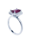 14K white gold ring with emerald-cut deep red ruby and diamond halo.