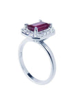 14K white gold ring with emerald-cut deep red ruby and diamond halo.