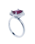 14K white gold ring with emerald-cut deep red ruby and diamond halo.