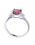Round cut natural pinkish-red ruby ring with accented diamonds in 14k white gold.
