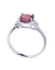 Round cut natural pinkish-red ruby ring with accented diamonds in 14k white gold.