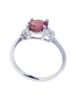Round cut natural pinkish-red ruby ring with accented diamonds in 14k white gold.