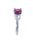 Round cut 1.64 ct. pinkish-red Mozambique ruby ring with accented diamonds in 14k white gold.