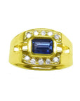 Men's sapphire ring east west emerald-cut bezel set 18k yellow gold, with a medium dark blue shade, bezel set in an east-west alignment.